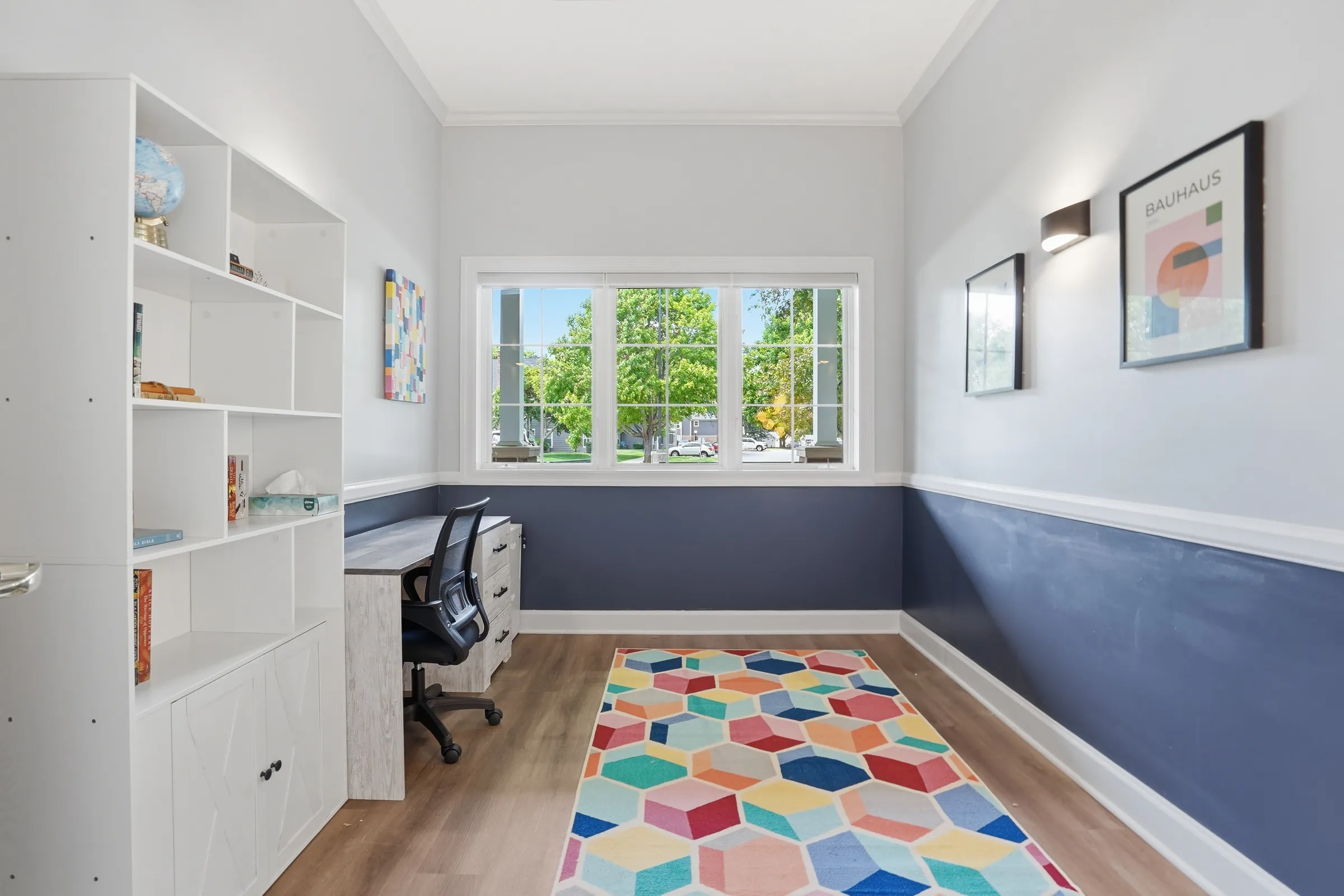 A quiet room with a desk and chair, suitable for a private video therapy session